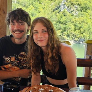 Annie and Levin hitch-hiking