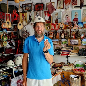and his happy customer (with loaned Albania hat)